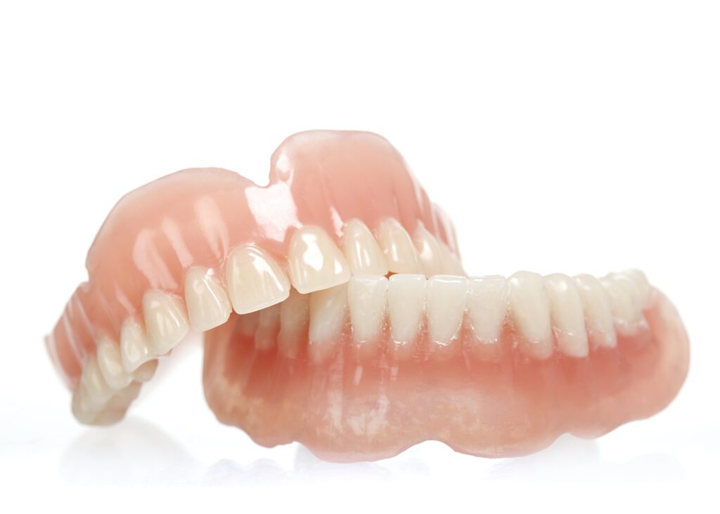 Deciding between DENTAL IMPLANTS VS DENTURES in Arlington Heights IL can be difficult